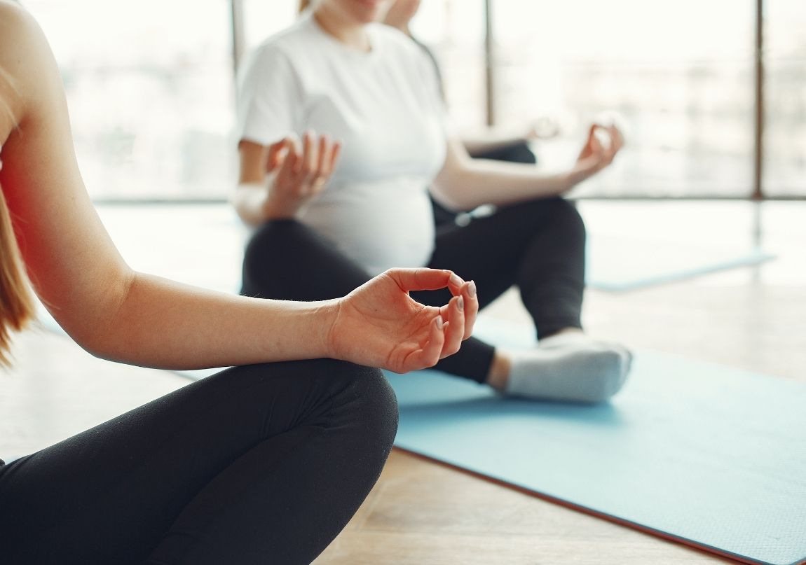 Pregnant women meditating